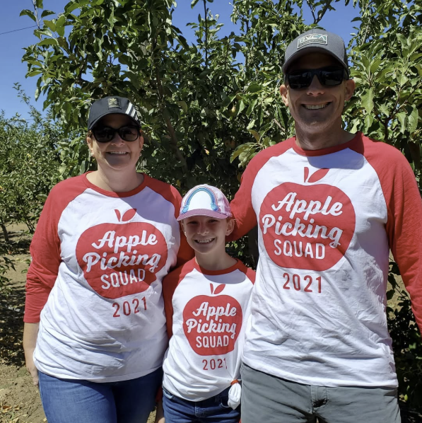 Family wearing matching Apple Picking Squad shirts